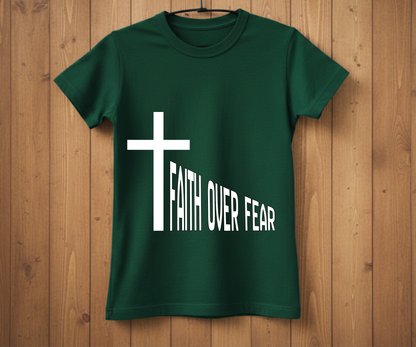 Green t-shirt with a white cross and 'Faith Over Fear' text on a wooden background