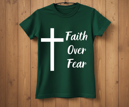 Green t-shirt with a white cross and 'Faith Over Fear' text on a wooden background
