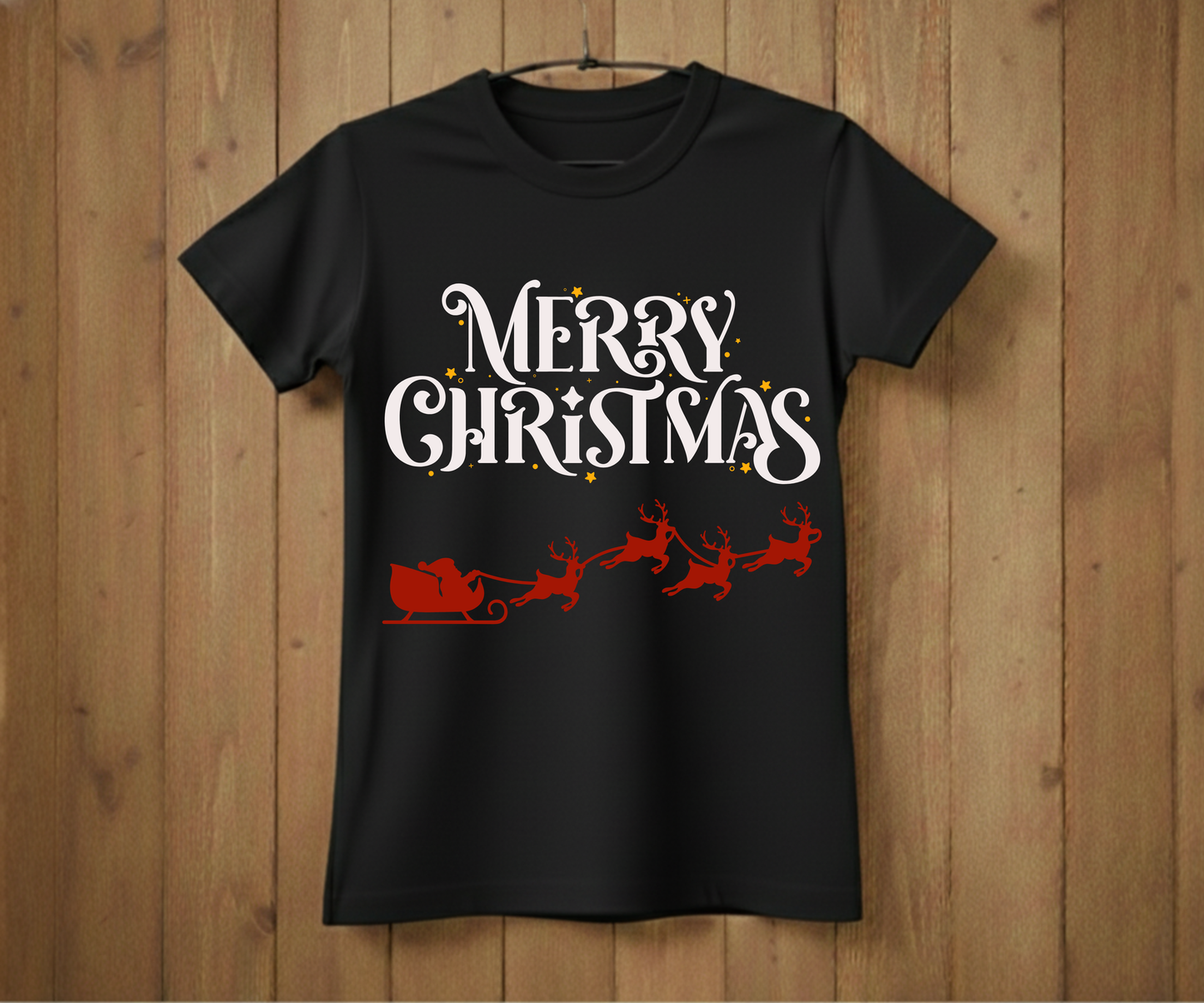 Black t-shirt with 'Merry Christmas' text and Santa sleigh design on a wooden background
