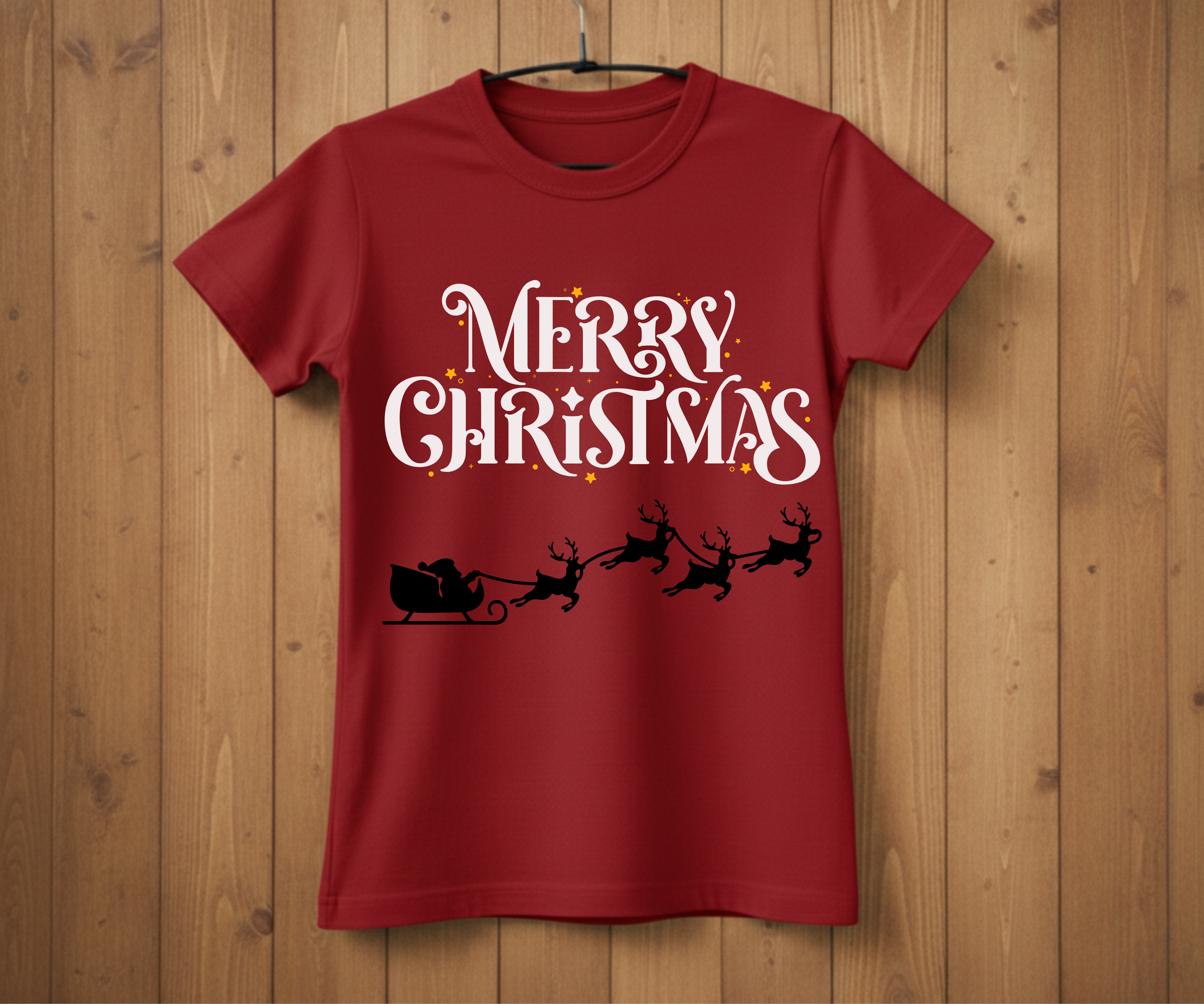 Red t-shirt with 'Merry Christmas' design on a wooden background
