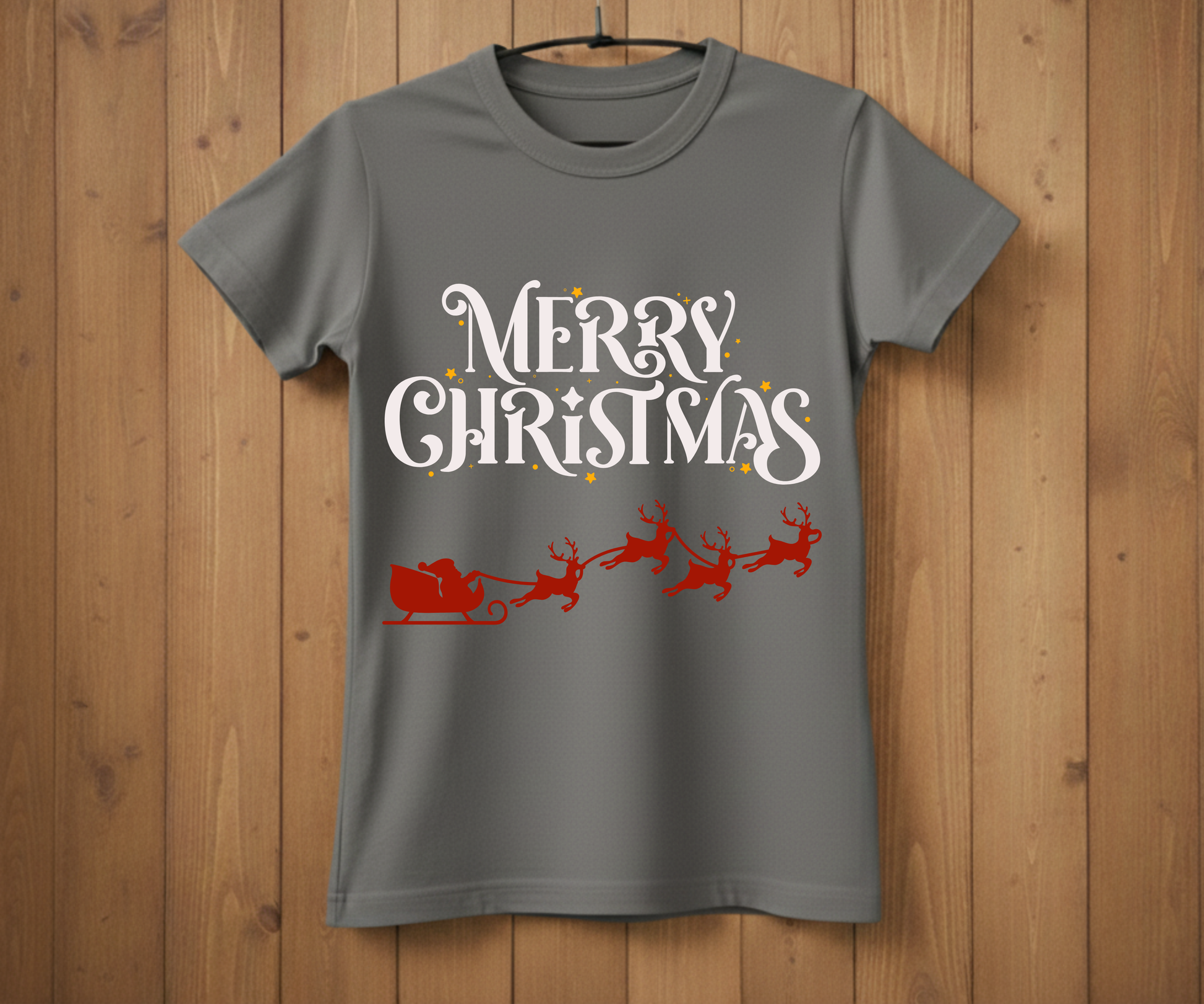Gray t-shirt with 'Merry Christmas' and Santa Claus graphic on a wooden background